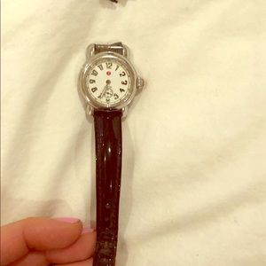 Small round-faced Michele watch.